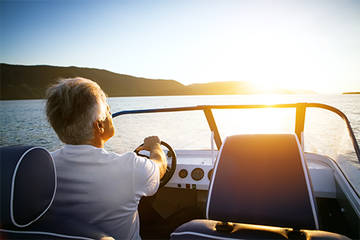 Man Driving A Boat