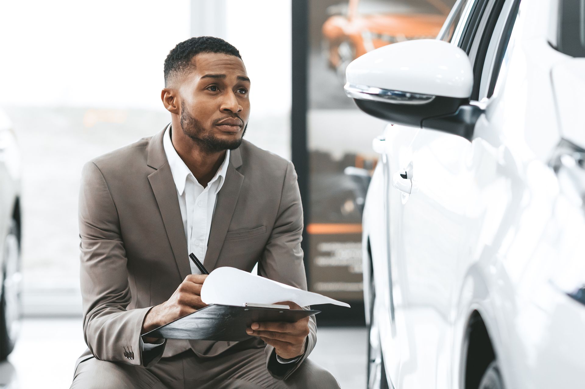 Auto Insurance Agent Checking The Car