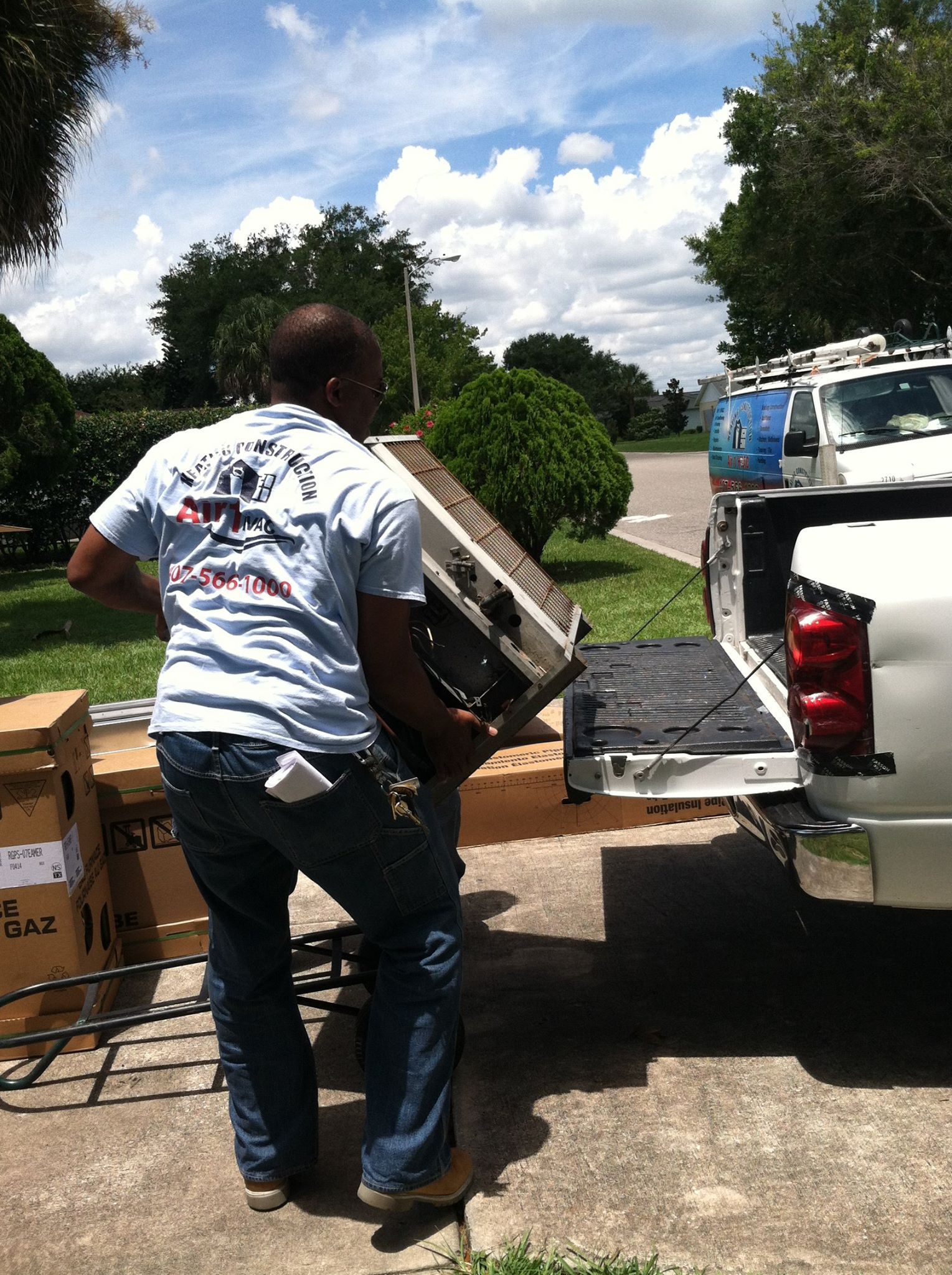 a man is working on an air conditioner in a living room .