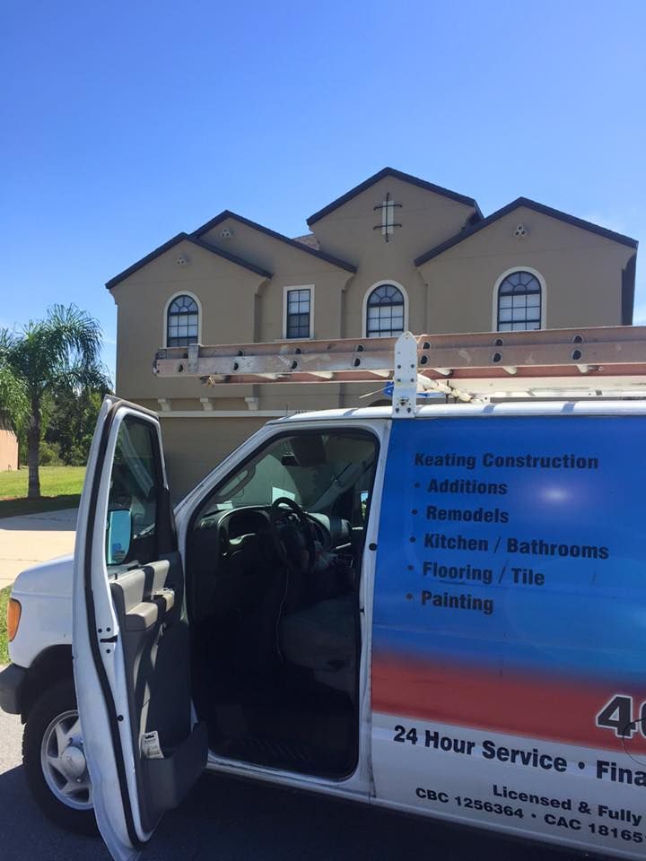 a 24 hour service van is parked in front of a house .