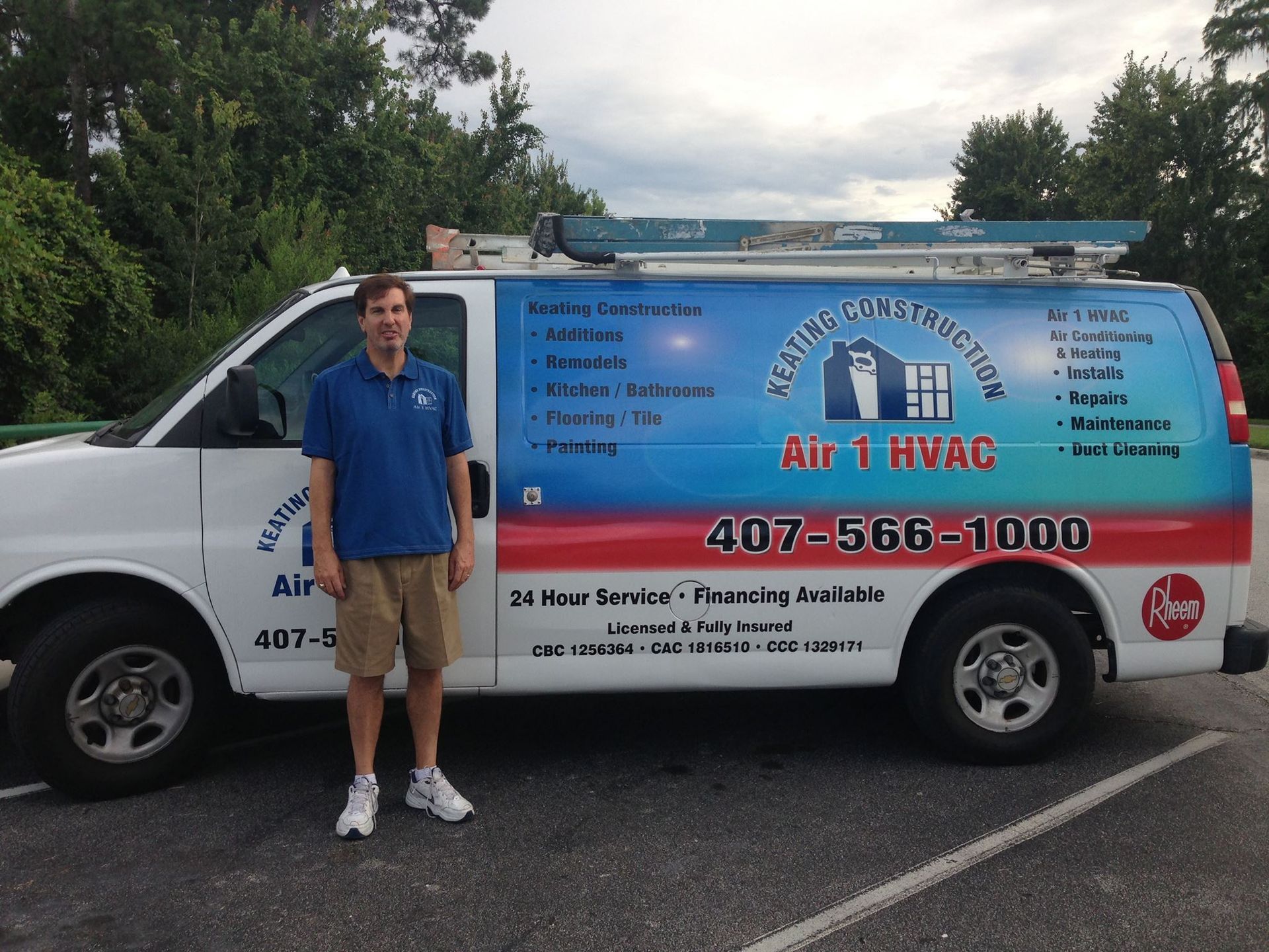 a man standing in front of a van that says air 1 hvac