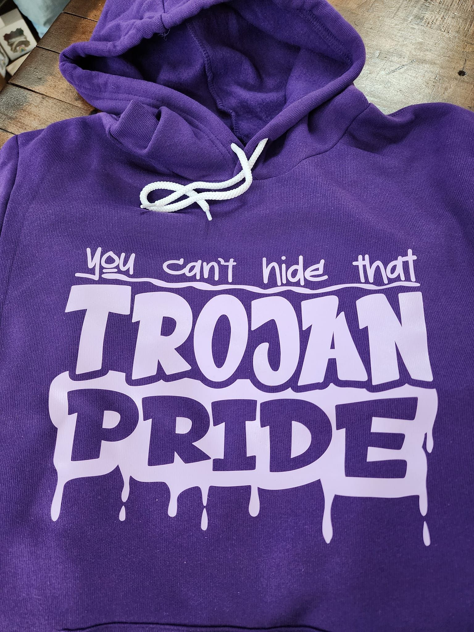 Purple hoodie with white text: