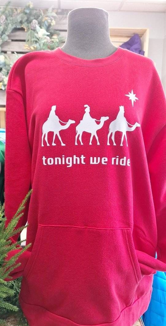Red sweatshirt with white graphic of three camels, riders, a star and