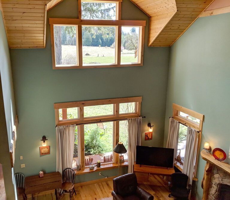 An aerial view of a living room with lots of windows