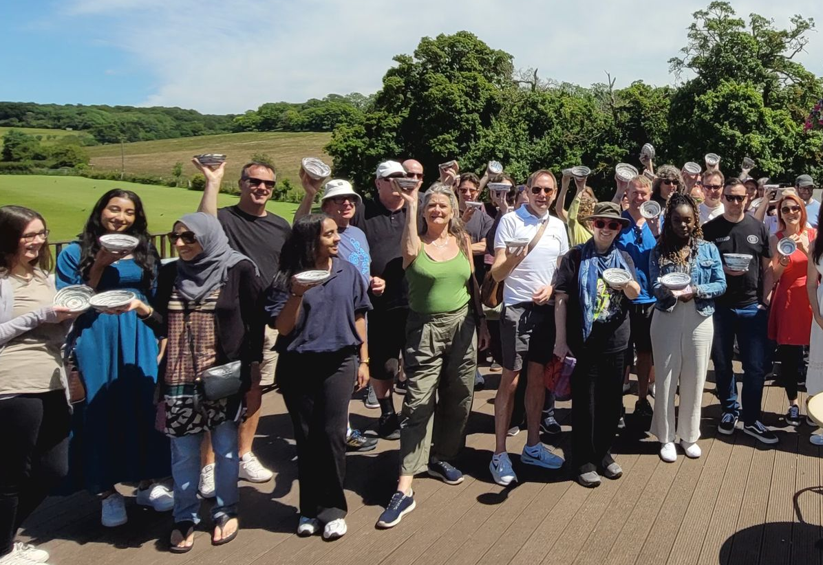 Team doing an eco-friendly workshop for corporate wellbeing and sustainability