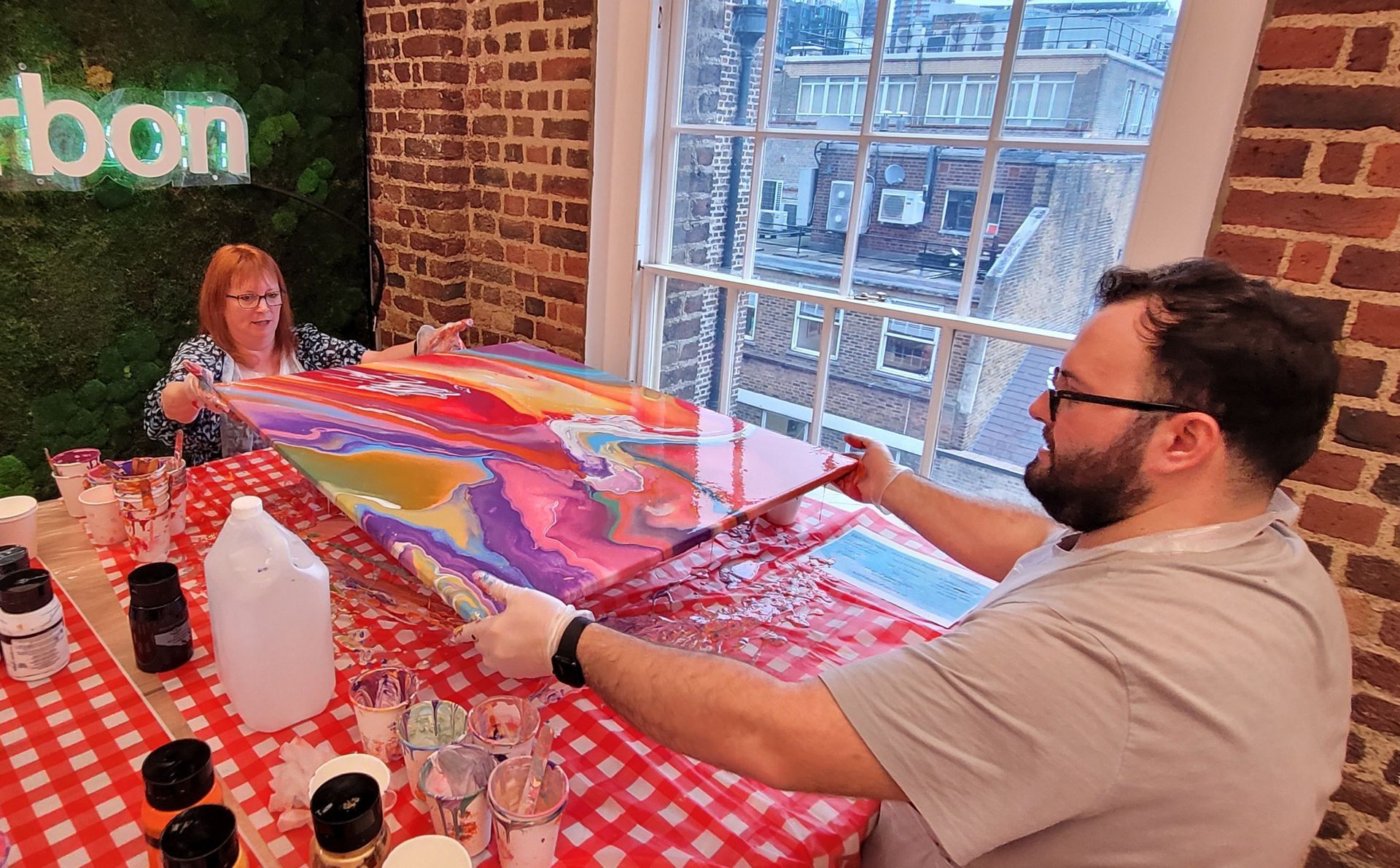 Carbon Underwriting doing an in-person acrylic pouring workshop