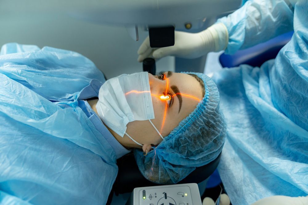 A woman is getting eye surgery in an operating room
