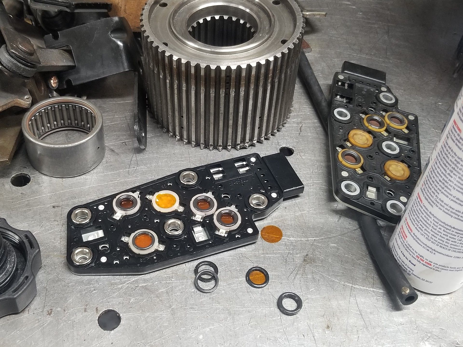 Disassembled transmission components on a workbench | Riley Auto Care & Transmissions
