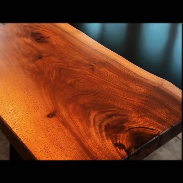 A close up of a piece of wood with a black background