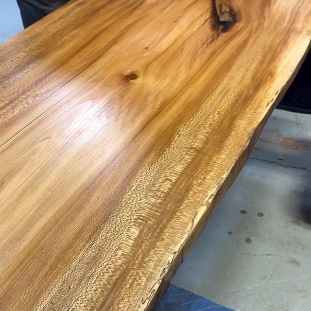 A close up of a wooden table with a hole in the middle