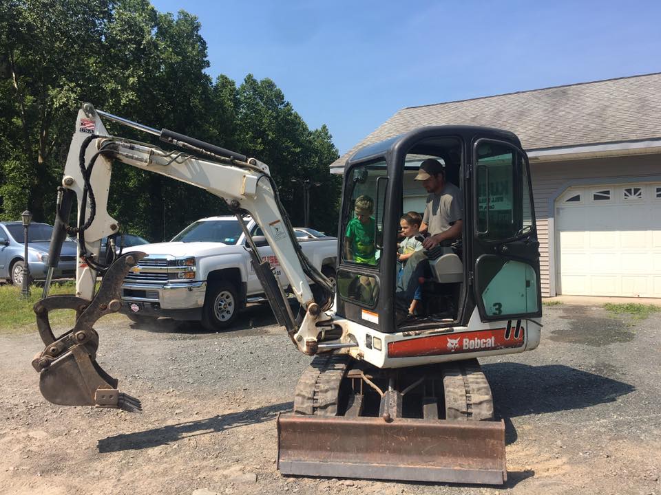 Excavator and a Car — Roaring Branch, PA — Kuser Well Drilling