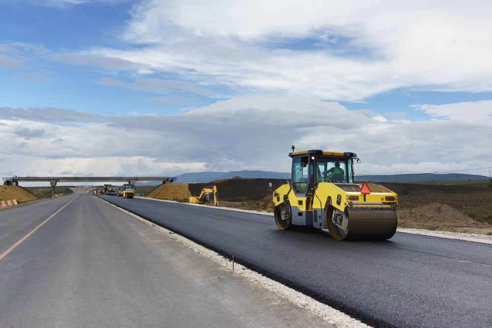 Road Roller Compacting Asphalt on a Newly Paved Highway — Damon's Earthworks in Chatsworth, QLD