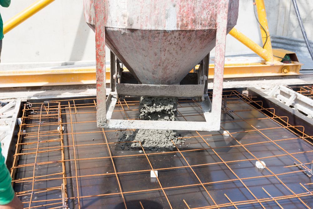 Concrete Being Poured From a Hopper — Damon's Earthworks in Chatsworth, QLD