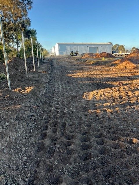 Person Using a Wrench on a Drill Bit — Damon's Earthworks in Chatsworth, QLD