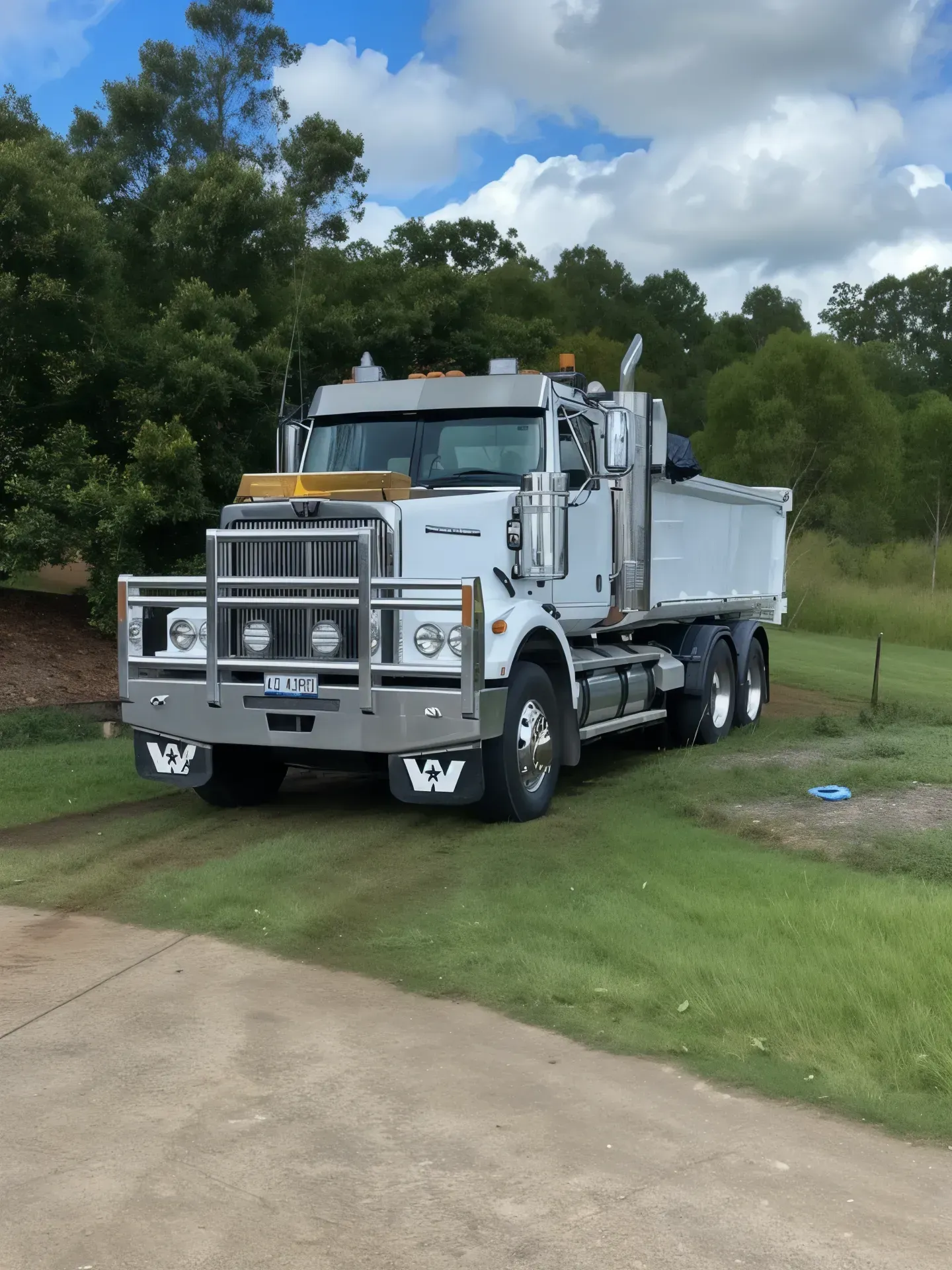 Dump Truck Unloading Gravel by the Water — Damon's Earthworks in Chatsworth, QLD