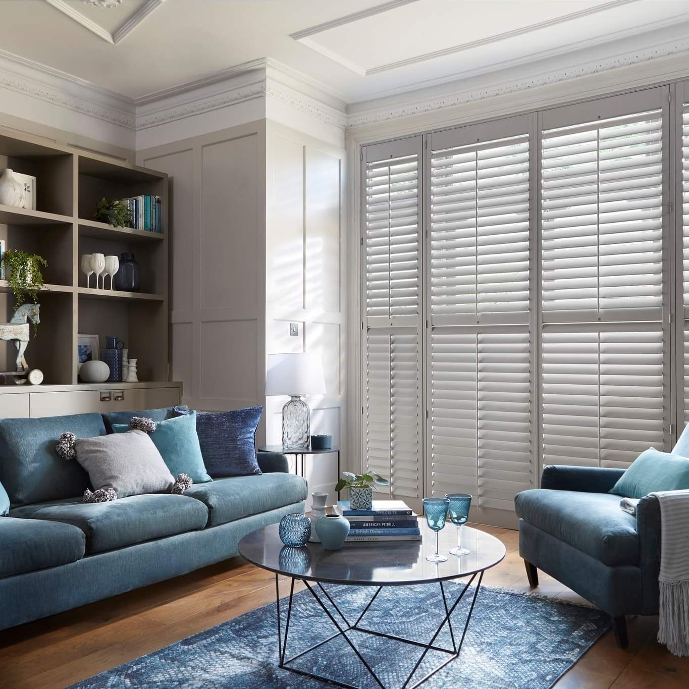 A living room with a couch a chair and a coffee table
