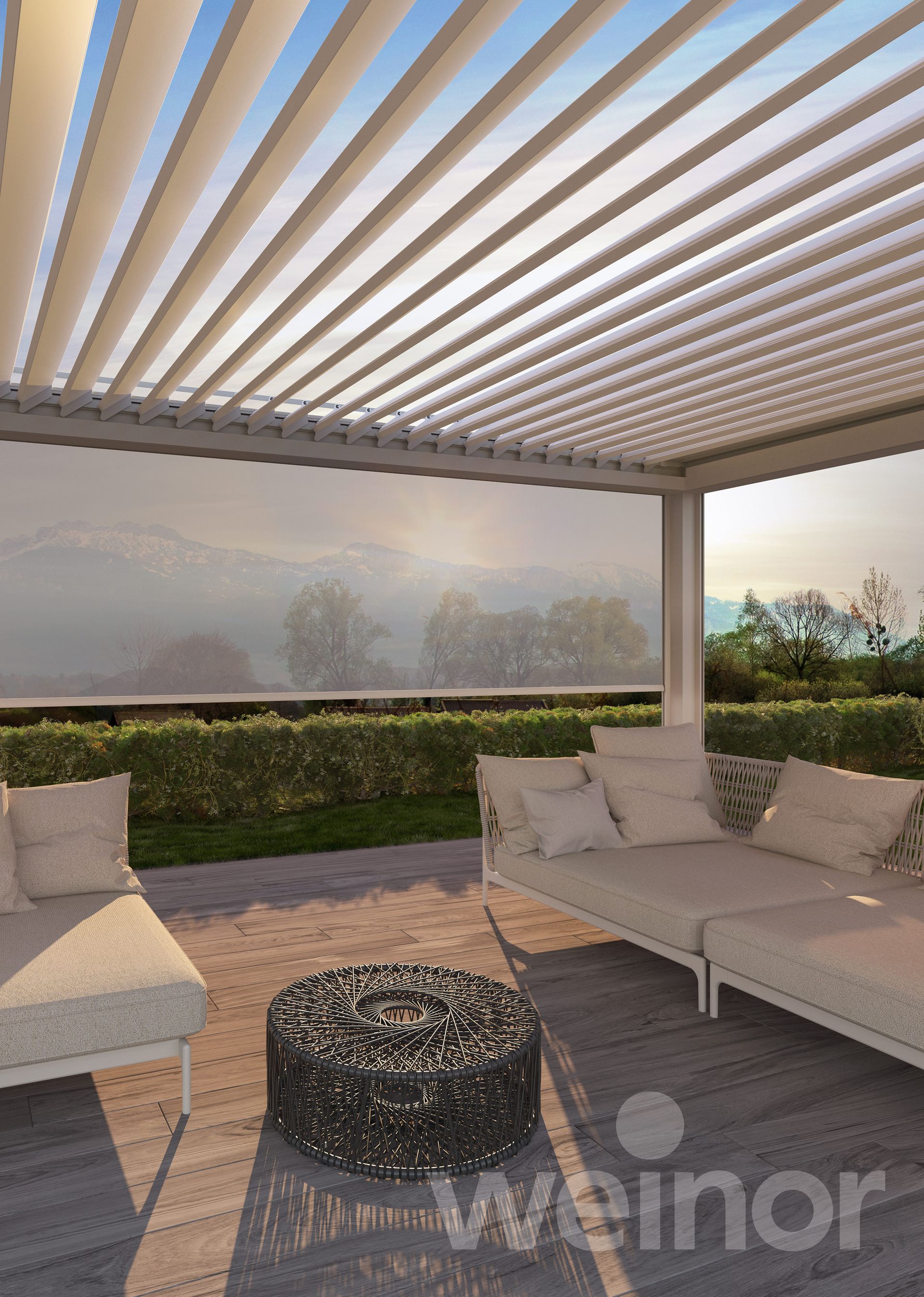 A patio with a couch and a table under a pergola.