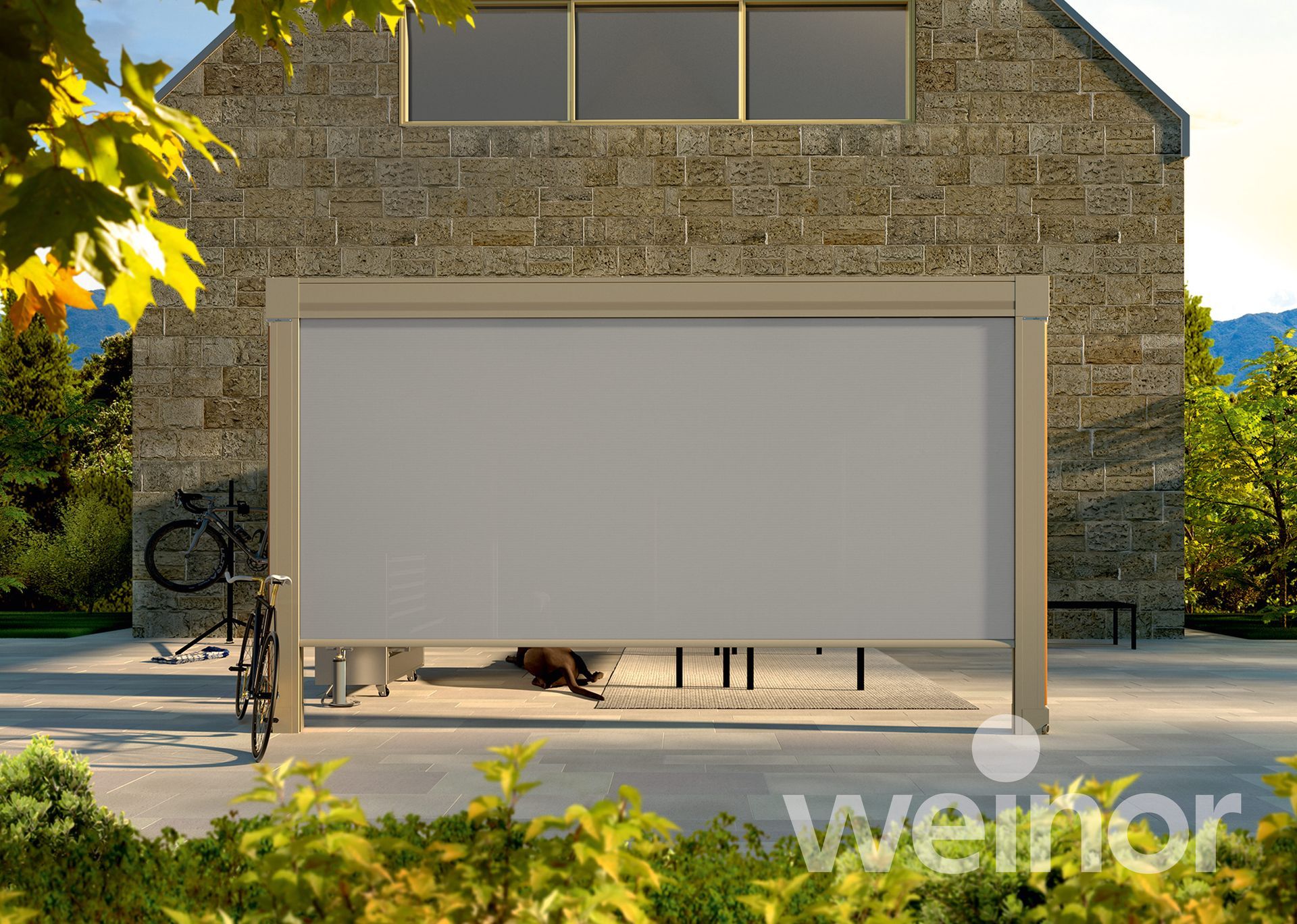 A brick building with a large white screen on the side of it.