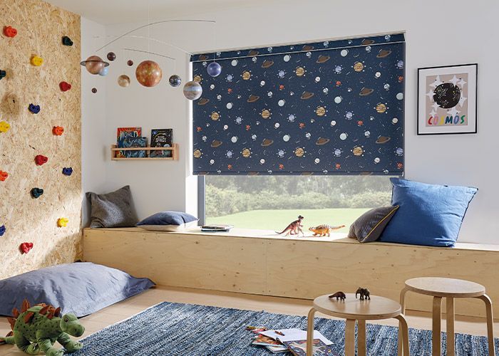 A child 's room with a window seat and a climbing wall.