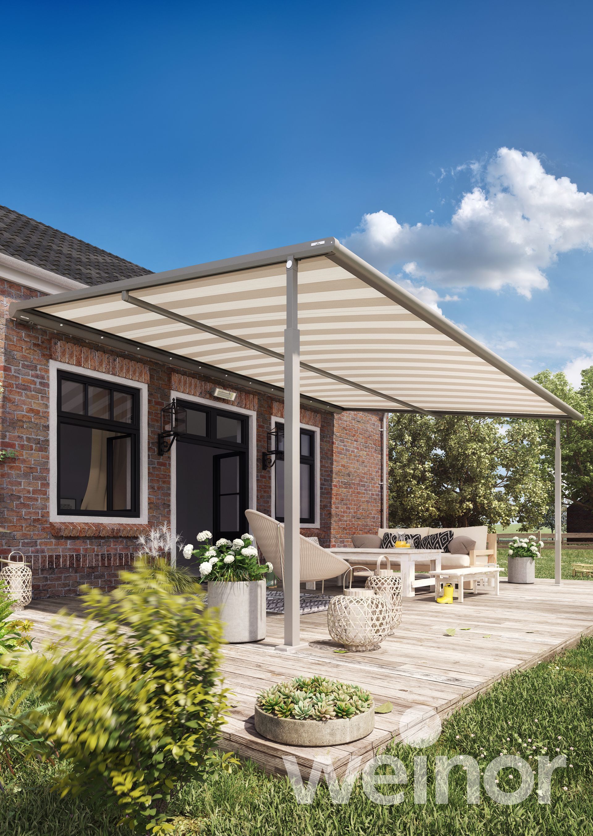 A patio with a canopy over it and a brick house in the background.