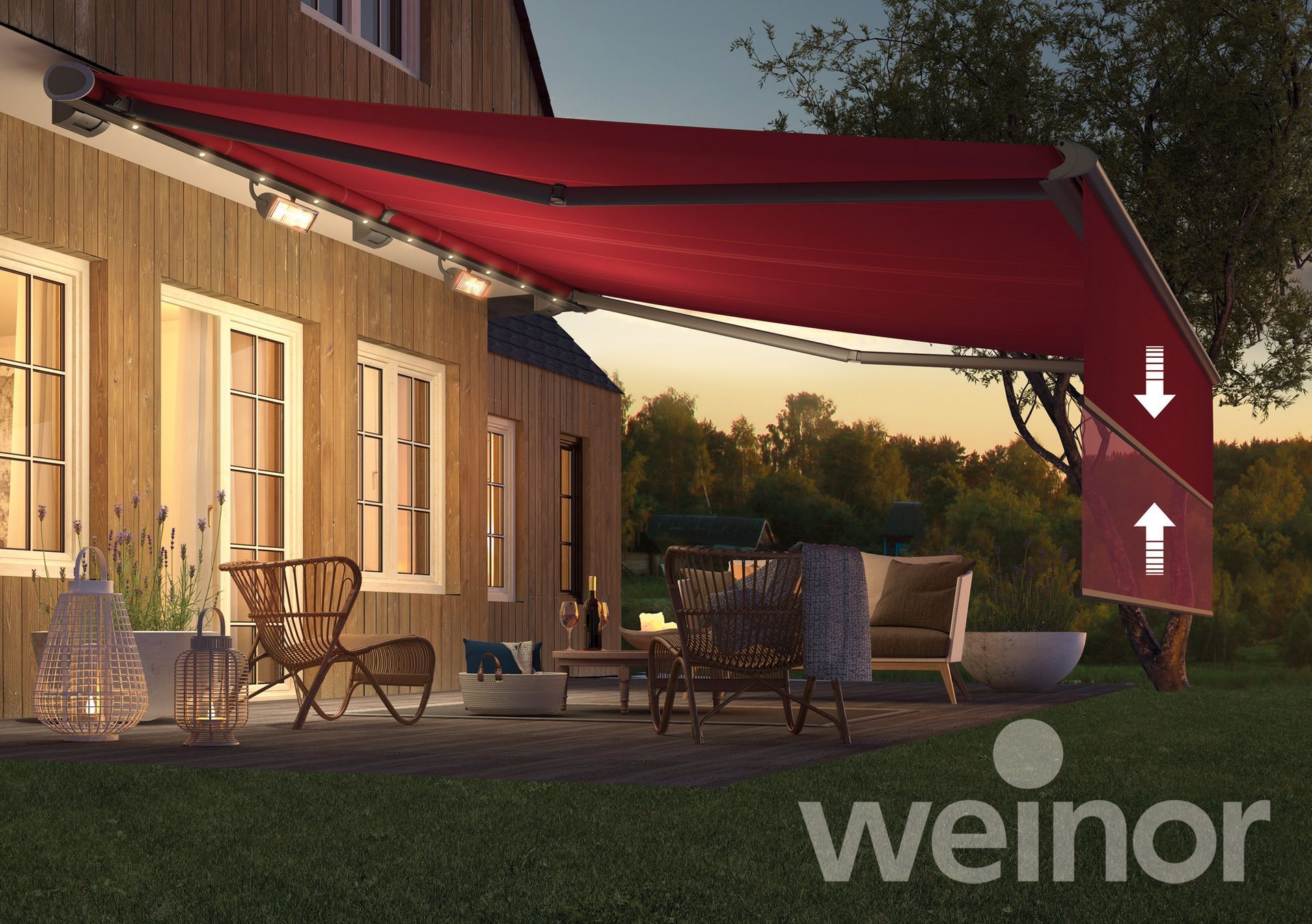 A red awning is sitting on a patio in front of a house.