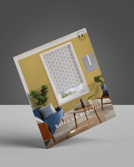 A brochure for roller blinds is sitting on a table.