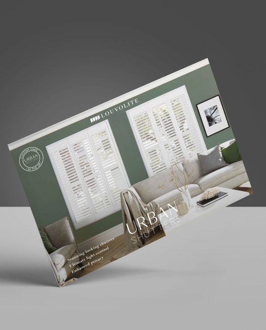 A brochure for a living room with a couch and chairs on a table.