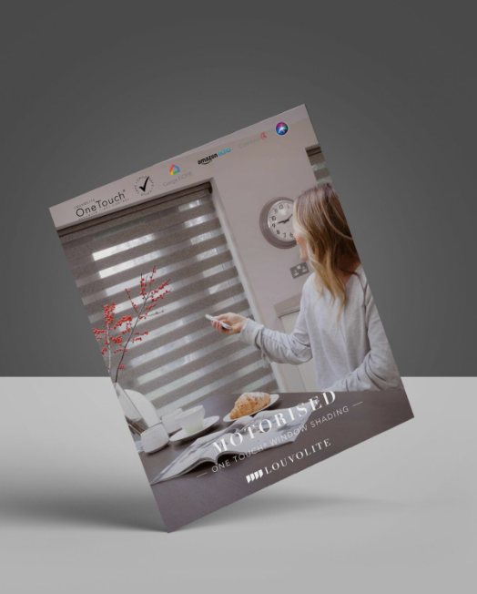 A woman is sitting at a table with a clock on the wall.