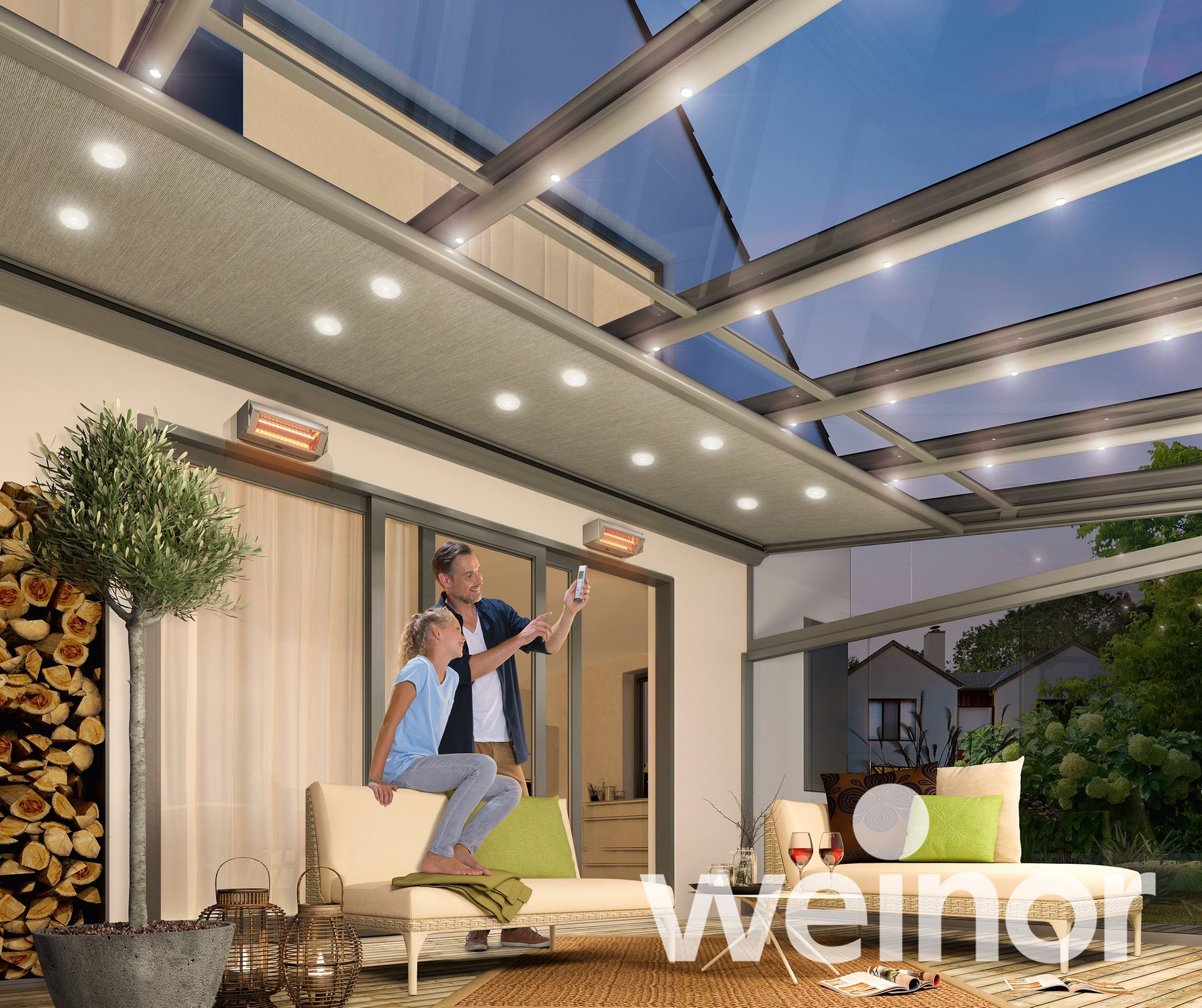 A man and a child are sitting on a couch under a glass roof.