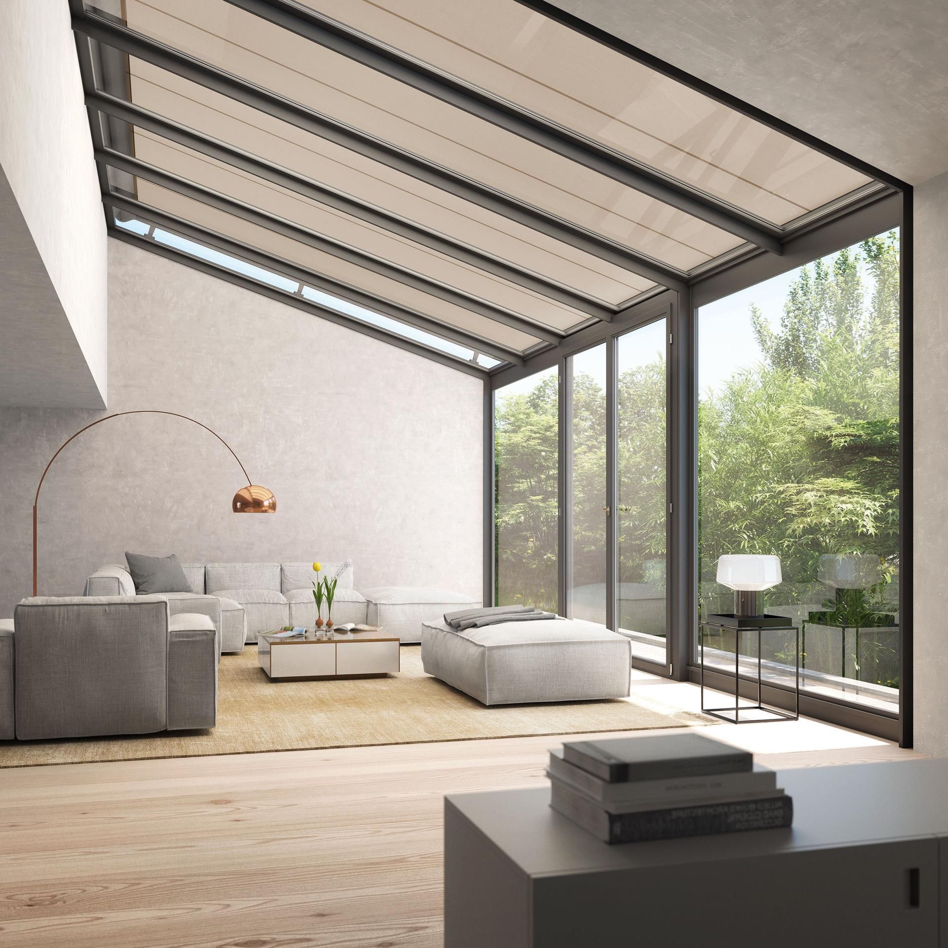 A living room with a lot of windows and furniture