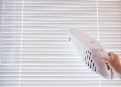 Cleaning Window Blinds Using Vacuum Cleaner — St. Louis, MO — Overland Shade Co.
