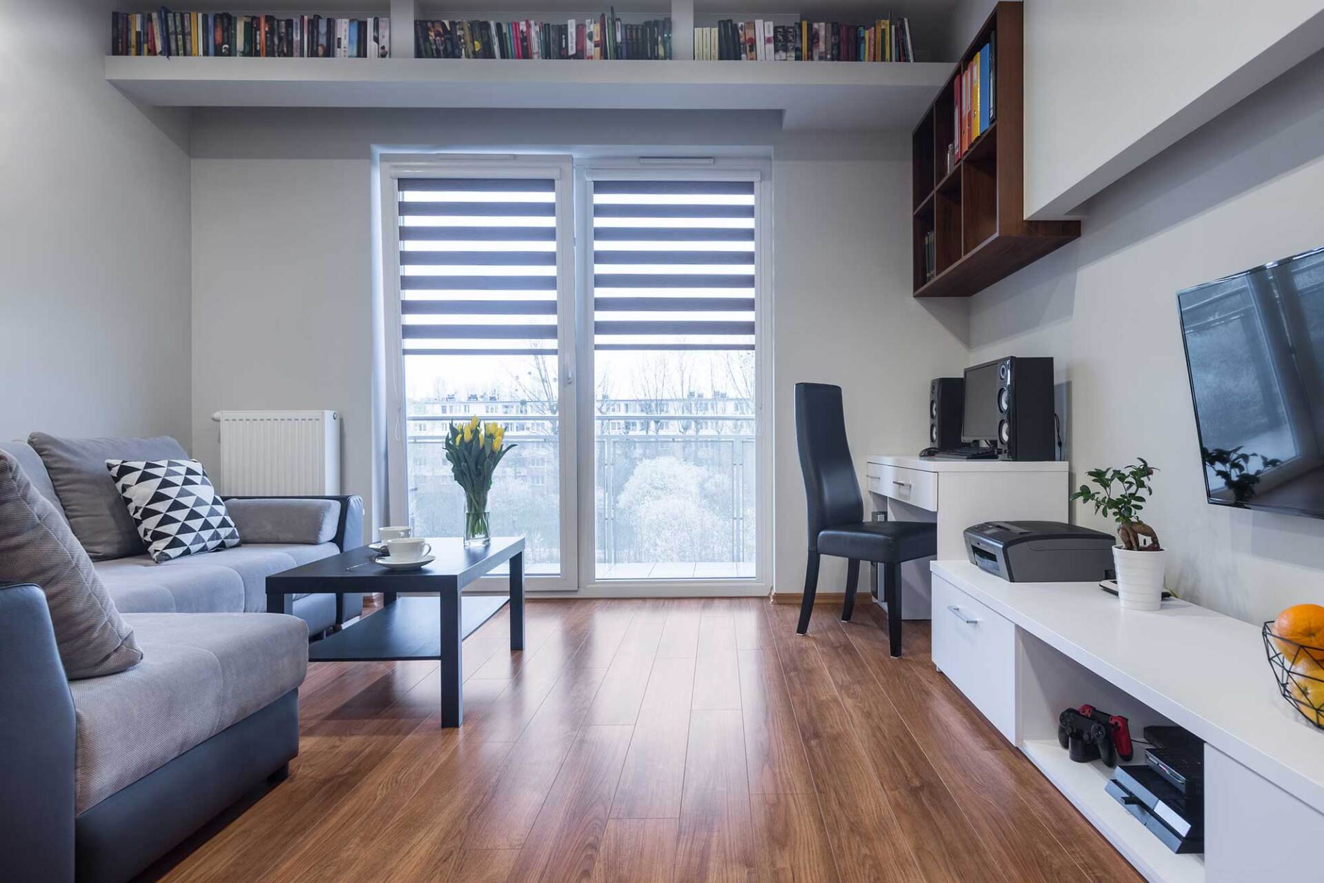 Home Interior with Window, TV and Large Sofa — St. Louis, MO — Overland Shade Co.