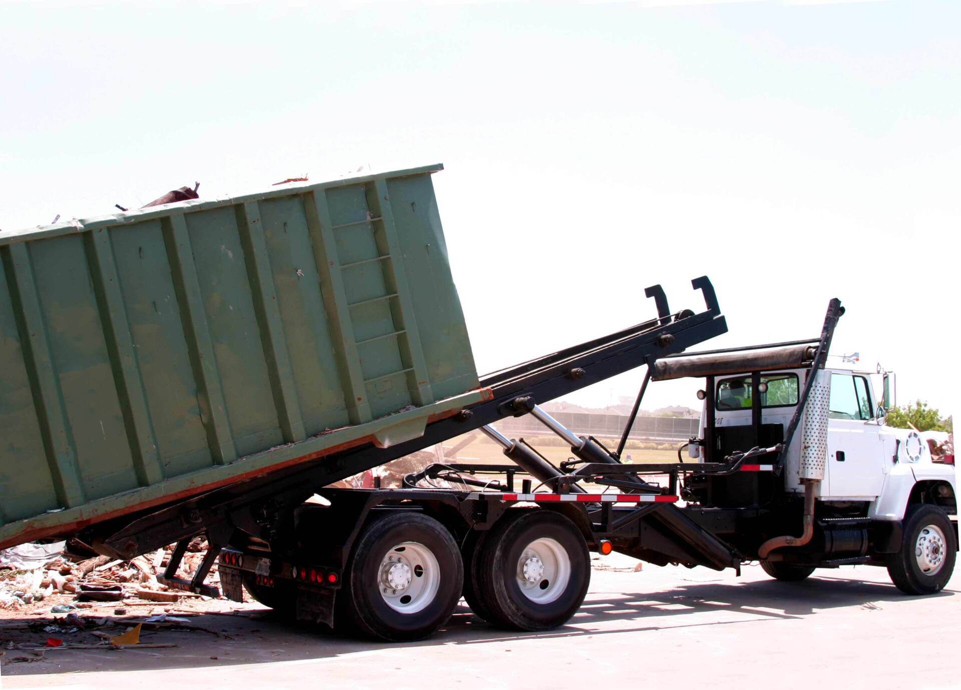City Truck Unloading Dumpster Of Trash — White Marsh, MD — Good Shepherd Septic Service