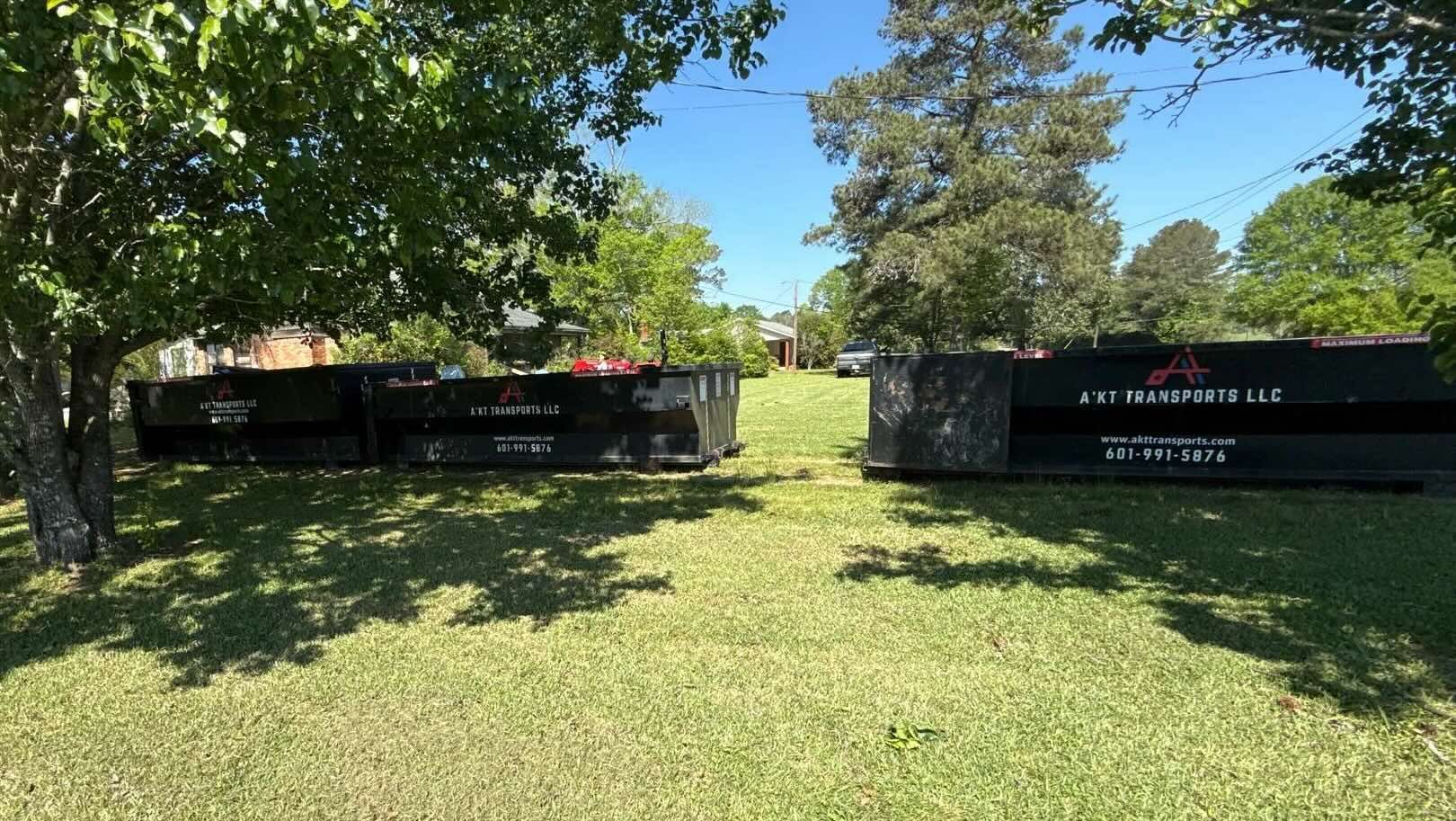 A photo demonstrating several dumpster sizes.