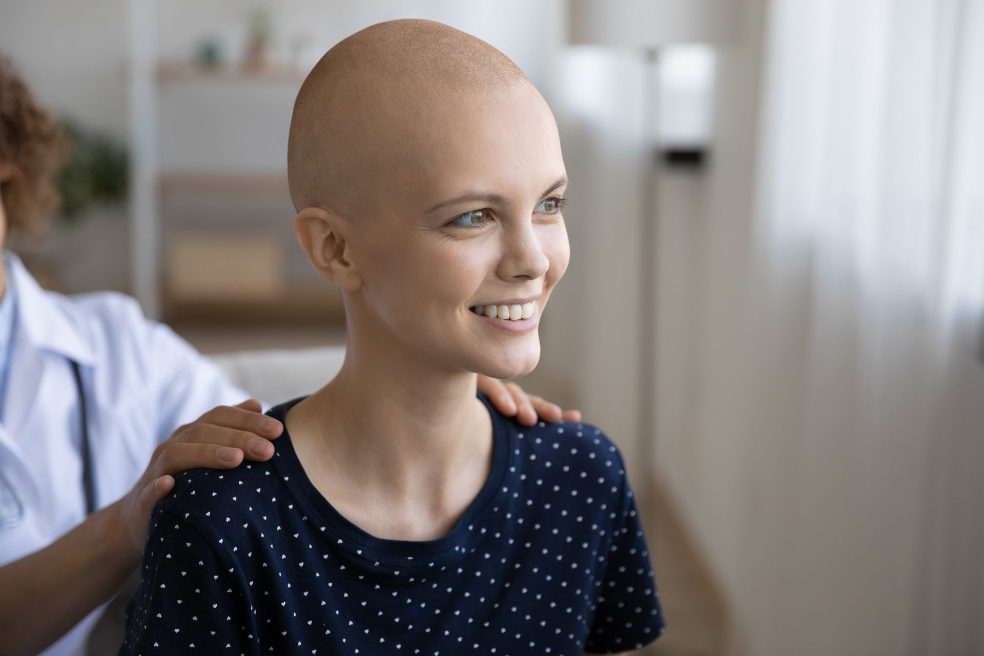 Oncology patient preparing for supportive cancer massage therapy.