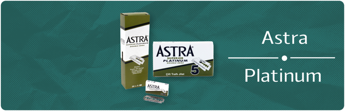 A picture of astra platinum razor blades on a green background.