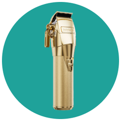 A gold hair clipper is sitting in a circle on a blue background.