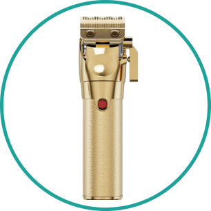 A gold hair clipper is in a circle on a white background.