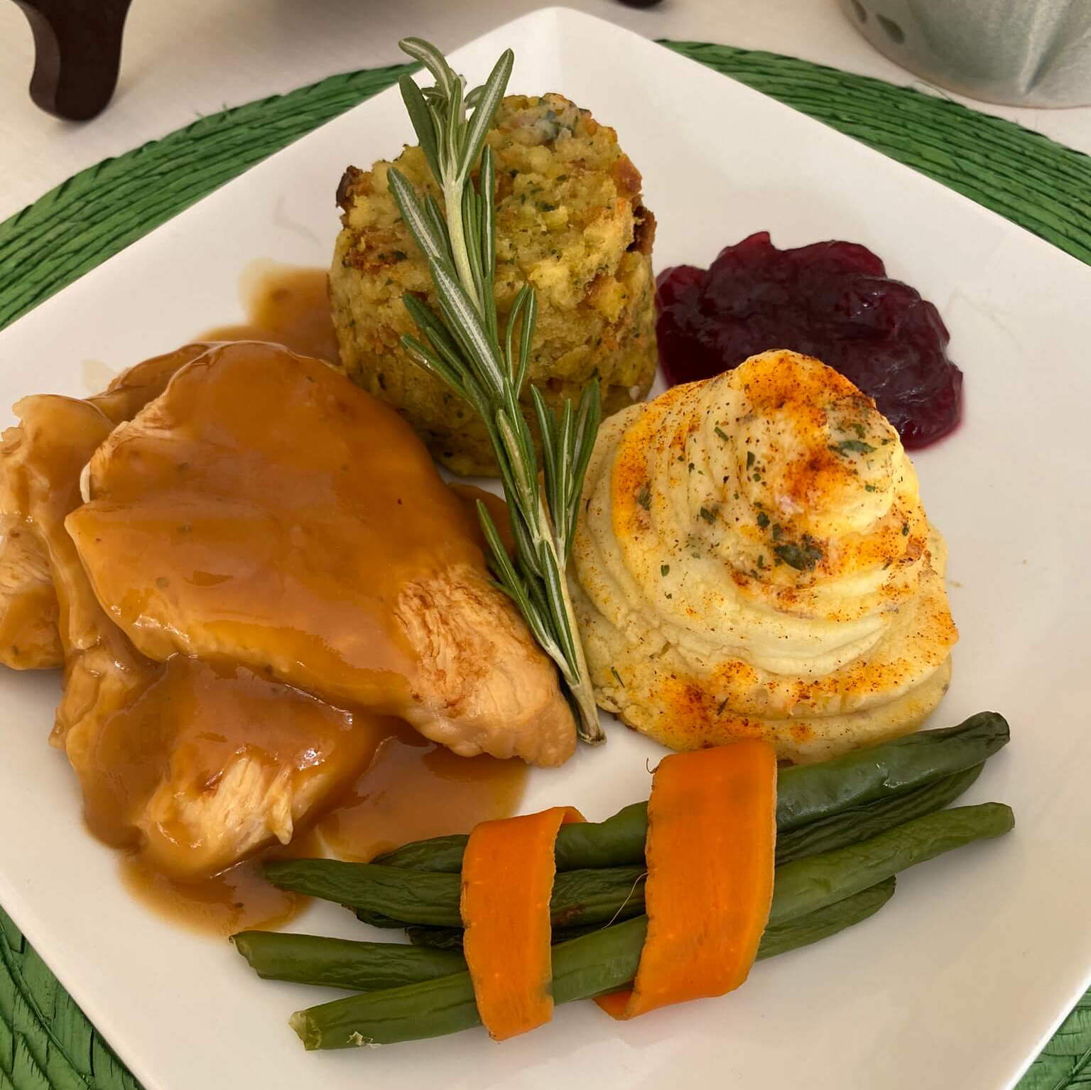 chicken, potato's, green beans plate of food made by retirement community chef