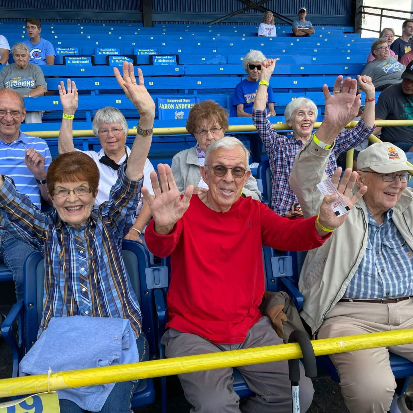 group of senior residents cheering on the Waterloo Bucks baseball team