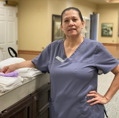 housekeeper ready to clean senior living apartments