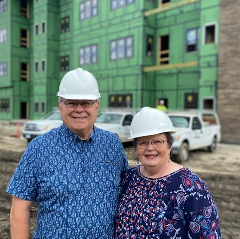 New senior residents of Village Terrace exploring the outside of their new home when under construction
