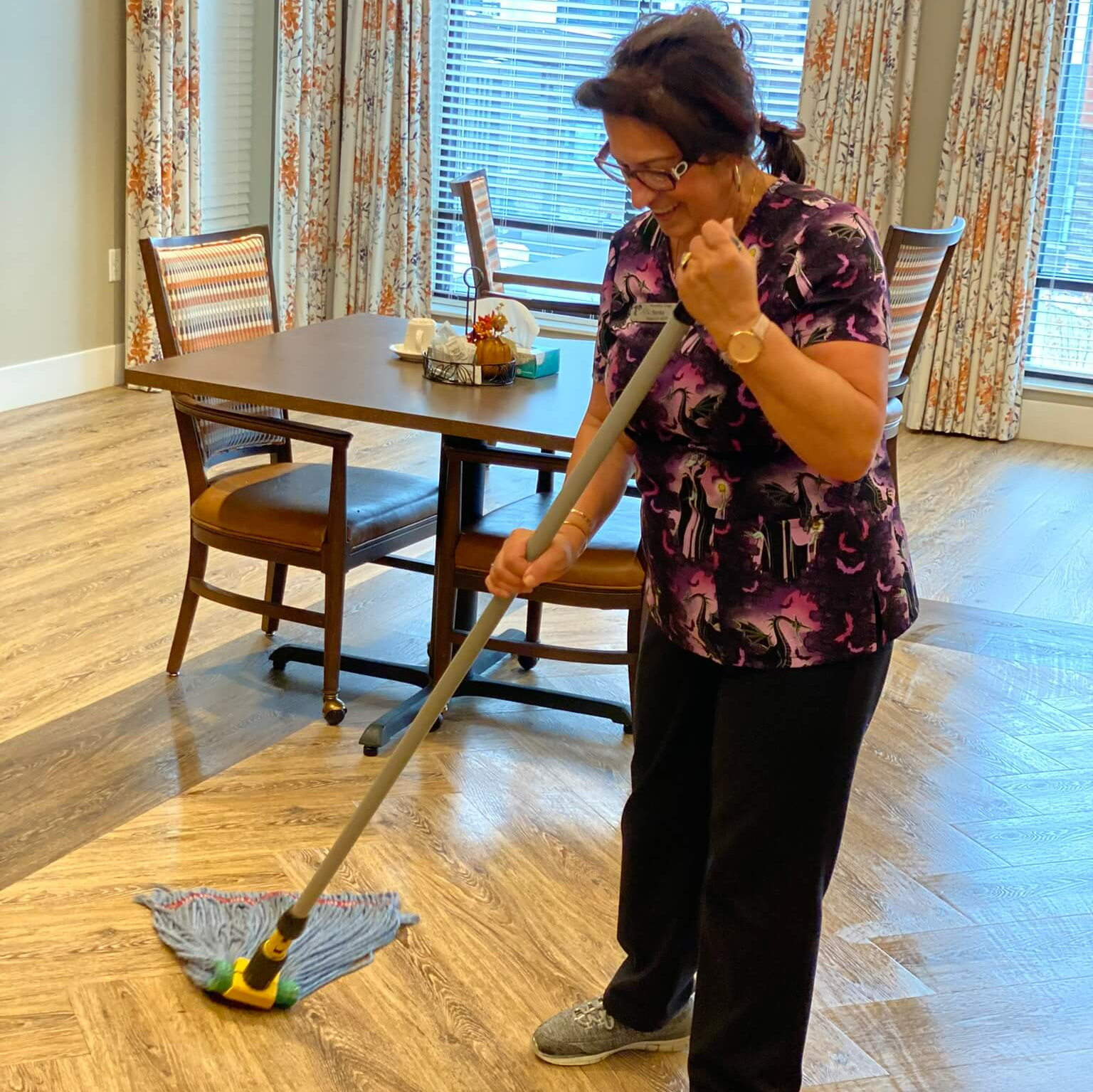 housekeepers sweeping up dust on the floor