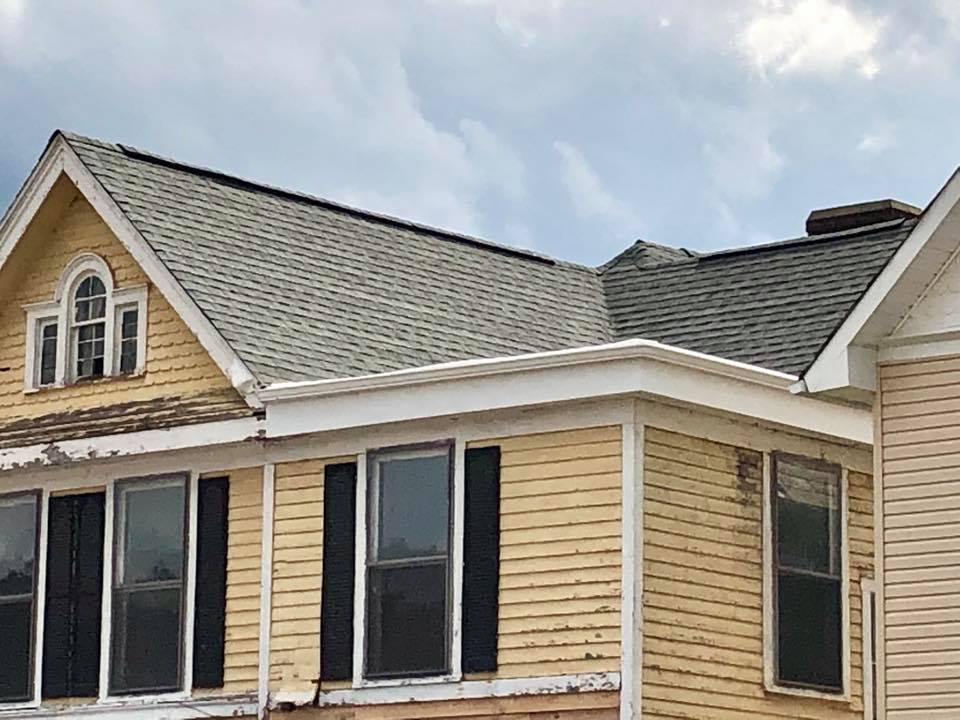 new windows on yellow house