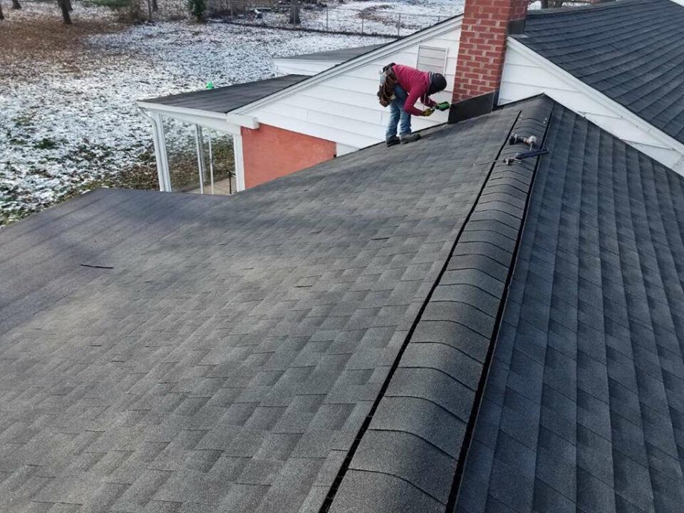 black shingle roof in winter