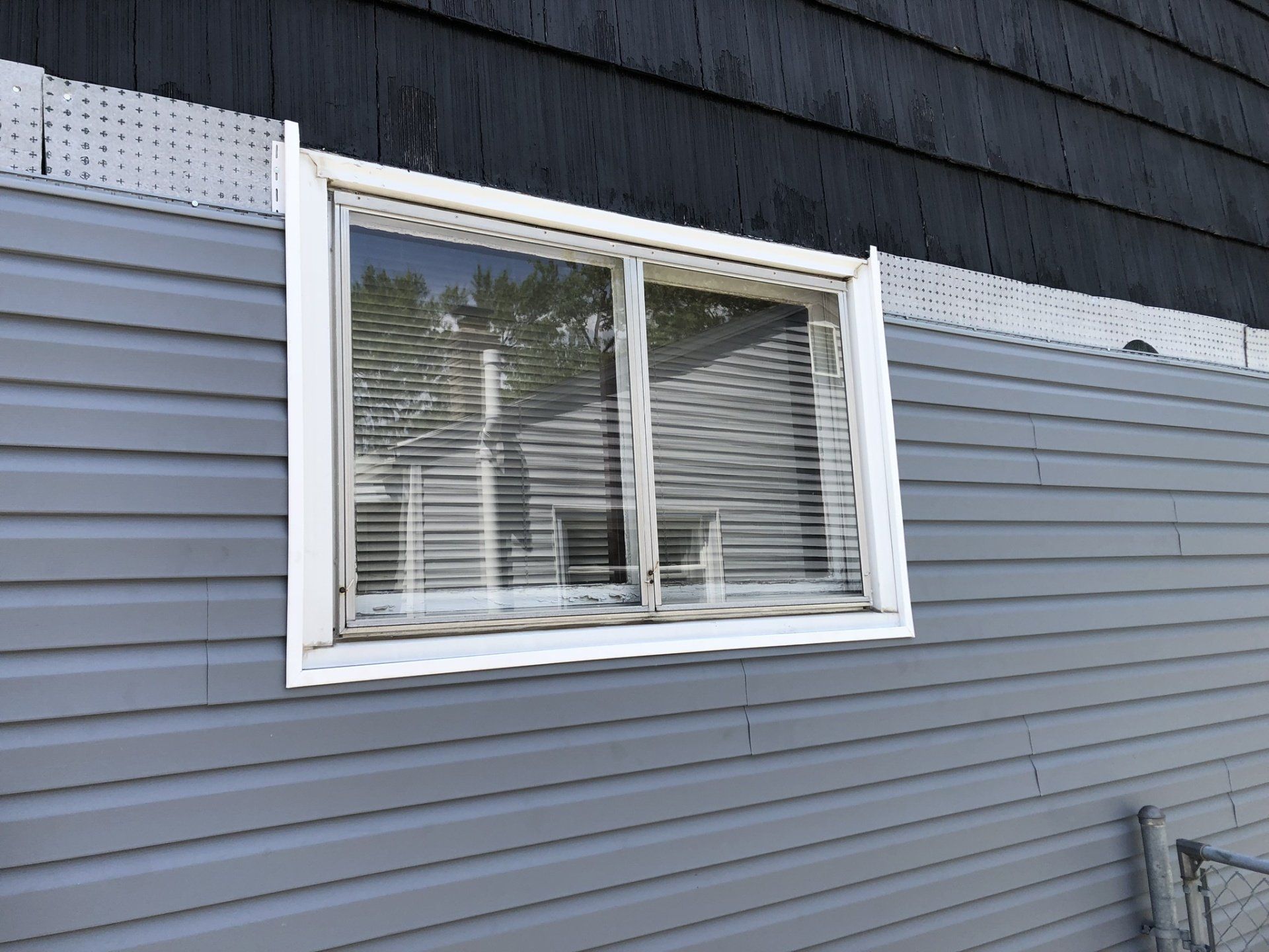 window on blue house
