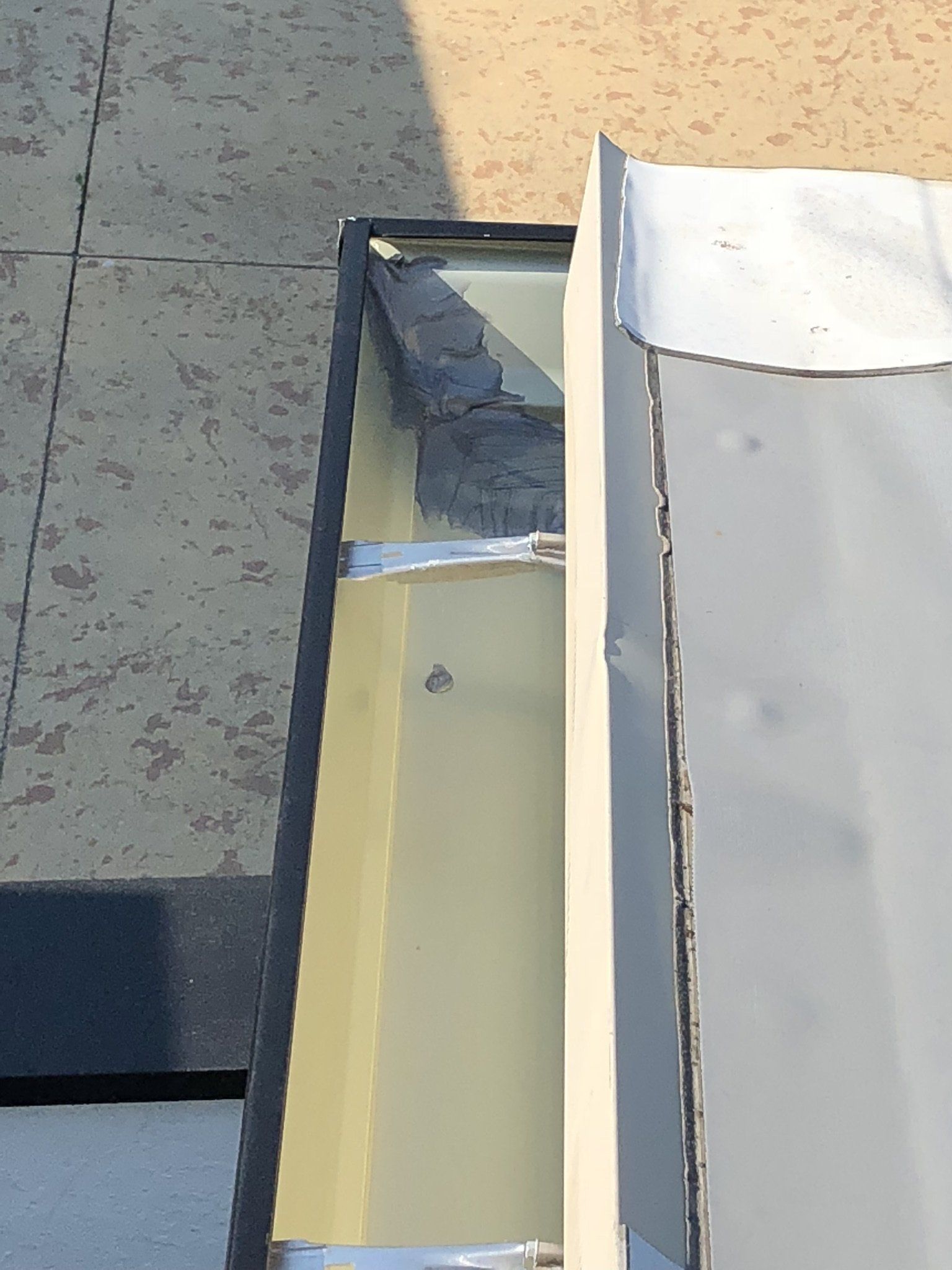 A close up of a gutter on a roof