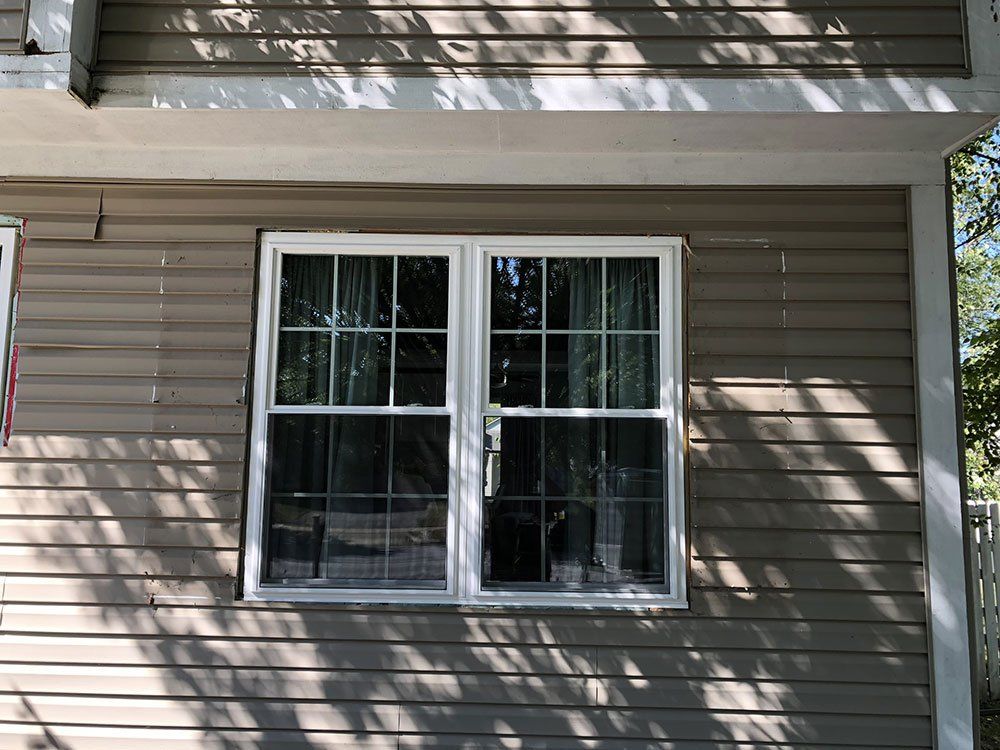 A house with a window and a flag on the side.