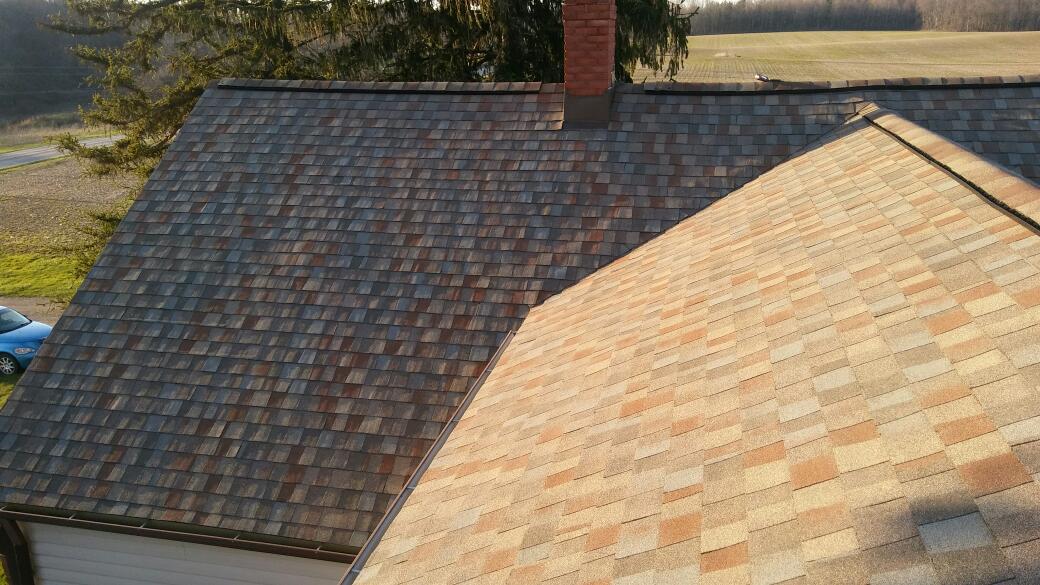An aerial view of a roof of a house with a chimney.
