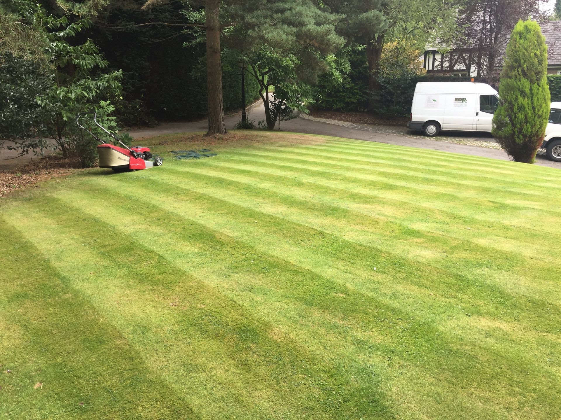 striped lawn that has been cut by mower